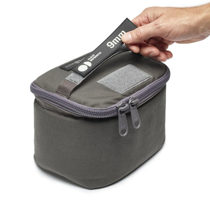 Front view of urban gray transport bag with patch on it.