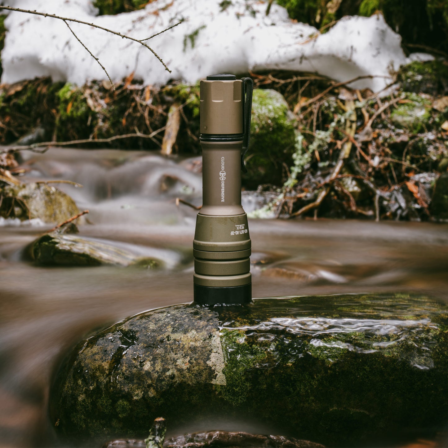 FDE MCH Duty on a river rock surrounded by water.